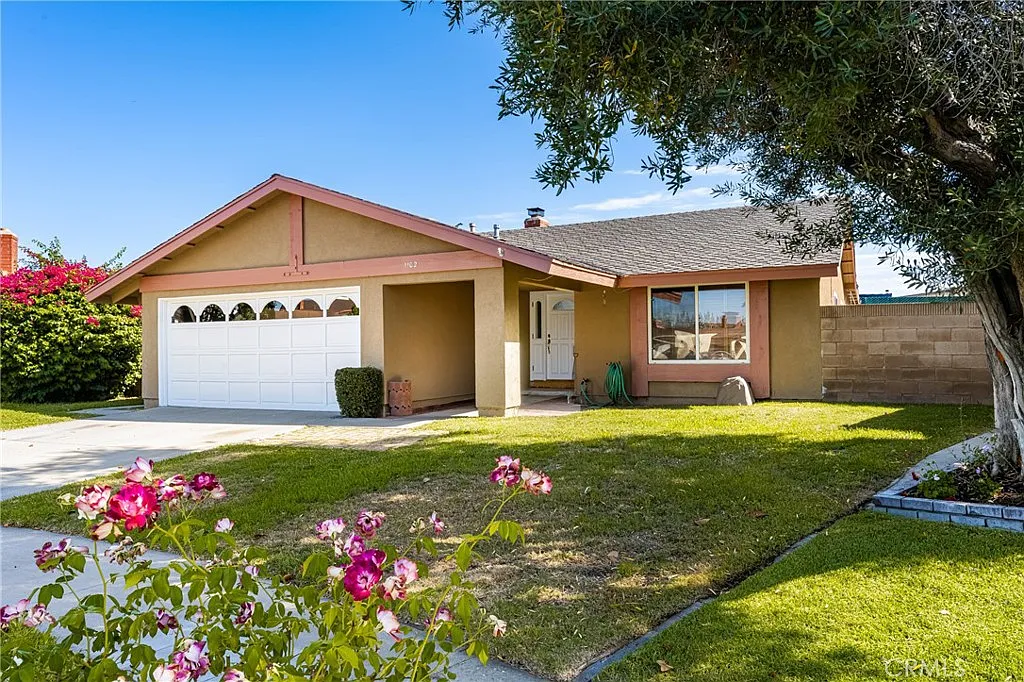 house with a white garage door, and front porch