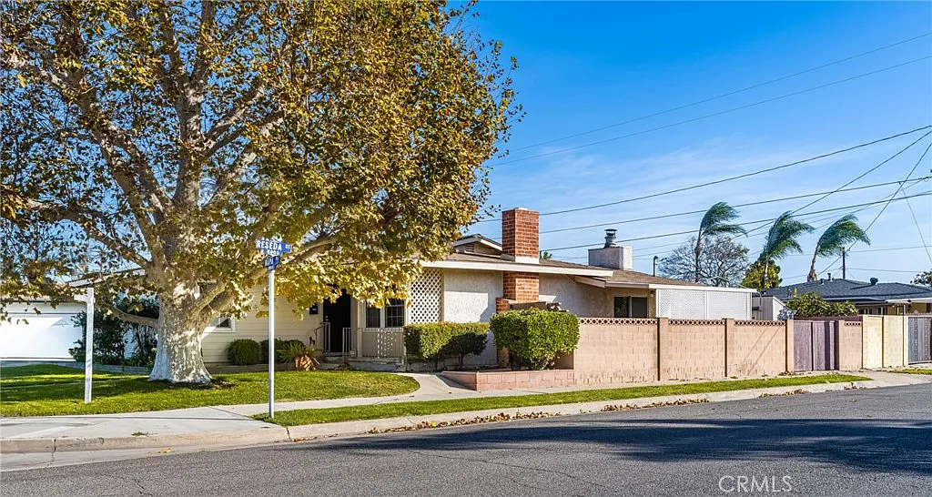 Single-story real estate home with a brick chimney
